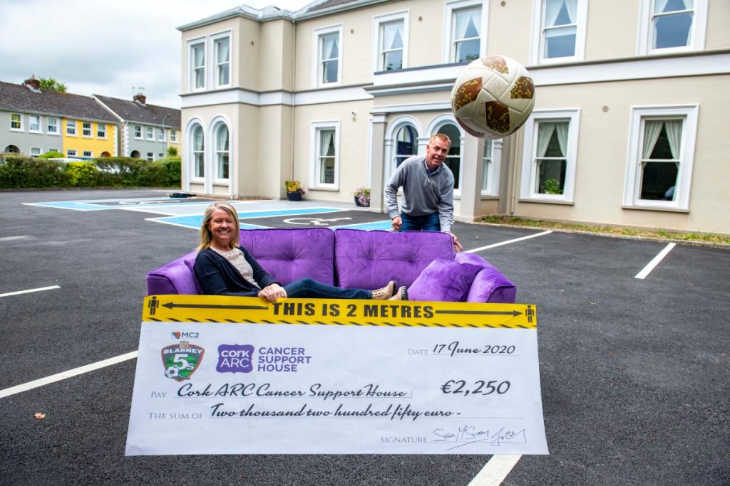 Sean McSweeney, partner at MC2, presents a cheque for €2,250 to Aileen O’Neill, CEO of Cork ARC in front of the newly refurbished Sarsfield House in Wilton.